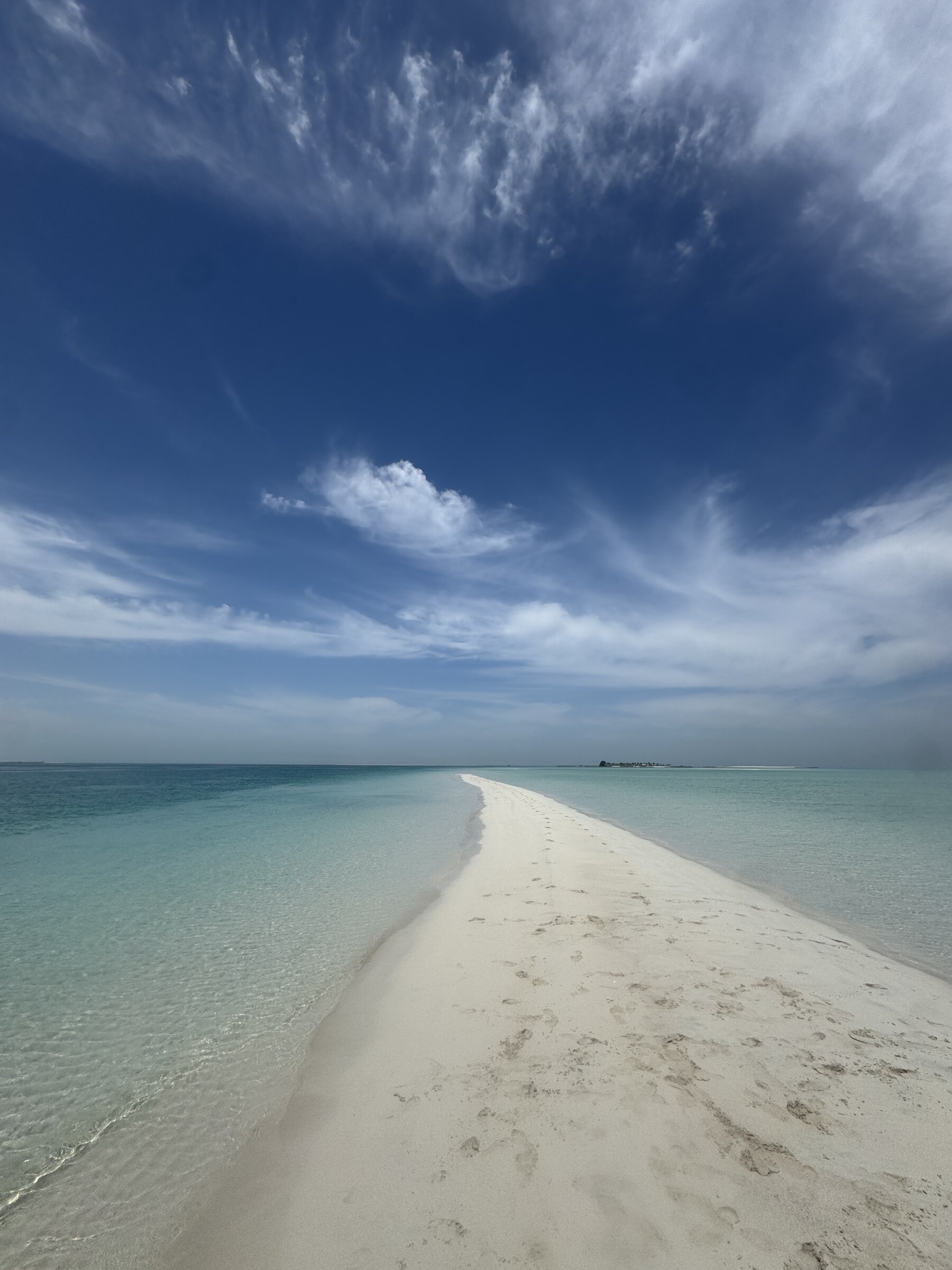 Sandbank meeting a wide open sky